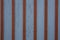 Aged pannel blue wood background with red stripes