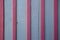 Aged pannel blue wood background with red stripes