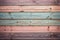 Aged pastel wooden planks with a mix of natural, blue, and orange tones, a rustic yet colorful backdrop