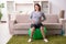 The aged pregnant woman doing exercises at home