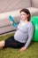 Aged pregnant woman doing exercises at home