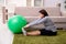 Aged pregnant woman doing exercises at home