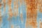 Aged rusty metal painted in blue color. vintage background