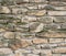 Aged stone pavement texture. Ancient natural cobblestone road.