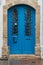 Aged and stylish blueish wooden doors