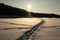 Aged Tracks: Snowy Beach\\\'s Beaten Path Illuminated by Golden Light. Garciema Pludmale, Latvija