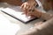 Aged woman patient signing medical insurance contract at doctor office