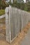 An aged wooden paling fence