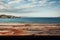 Aged wooden table texture juxtaposed with vast sky and serene sea