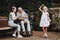 Aged and Young Family in Bench and Wheelchair.