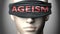 Ageism can make things harder to see or makes us blind to the reality - pictured as word Ageism on a blindfold to symbolize denial