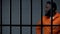 Aggressive afro-american prisoner in camera, serving life sentence, dangerous