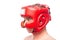 Aggressive boxer in red helmet on white