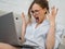 Aggressive career woman works at home. Screaming and frustrated woman with laptop