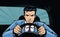 Aggressive driver behind the wheel of car. Race, pursuit in pop art retro comic style. Cartoon vector illustration