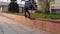 Aggressive Inline roller skater slides on the roller skates on the parapet in the rays of sun