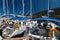 Agia Efimia, Cephalonia island, Greece - July, 14 2019: Close up of white yachts for rent against blue sky at a berth in