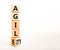 Agile and agility symbol. Concept words Agile and Agility on wooden cubes. Beautiful white table white background. Business agile