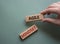 Agile Mindset symbol. Wooden blocks with words Agile MindsetAgile Mindset. Businessman hand. Beautiful grey green background.