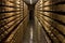 Aging cheese in a cellar of the Maison du Gruyere cheese factory in Switzerland. Gruyere is a famous swiss cheese generally known