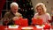 Aging couple opening presents on Christmas eve, tender relations through years