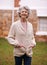 Aging with grace and poise. Portrait of a senior woman standing outside her house.