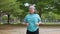 Aging mature woman do fitness outdoors in park at morning, fitness concept Taking care of the physical health of the elderly.