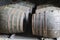 Aging old wooden barrels and casks in cellar at whisky distiller