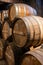 Aging process of cognac spirit in old French oak barrels in cellar in distillery in Cognac white wine region, Charente, Segonzac,