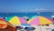 Agios nikitas beach in lefkada island sea beach umbrellas in many vivid colors blue sea in greece