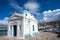 Agios Nikolaos church in Mykonos, Greece. Temple building with blue dome on sea quay. Church on sunny seaside. Summer