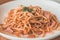 Aglio Olio Peperoncino Linguine & chicken strips tossed with olive oil, garlic and chilli flakes.  Topped with parmesan cheese and