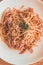 Aglio Olio Peperoncino Linguine & chicken strips tossed with olive oil, garlic and chilli flakes.  Topped with parmesan cheese and