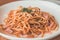 Aglio Olio Peperoncino Linguine & chicken strips tossed with olive oil, garlic and chilli flakes.  Topped with parmesan cheese and