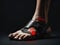The agony of a foot injury with a red circle highlighting the affected area