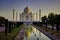 Agra, India - April 10,2014: Wide angle of Tajmahal with it`s reflection in the fountain pond, one of the seven wonder partially