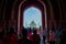 Agra, India - September 20, 2017: Crowd of people walking through a huge door with the Taj Mahal in the horizont , is an