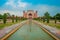 Agra, India - September 20, 2017: Unidentified people walking at the garden near of Taj mahal at the entrance of Great