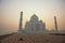 Agra, India. White marble Taj Mahal complex with minarets and wa