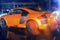 Agressive and brutal orange sport car on rained road picture useful for background