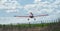 Agricultural aircraft over corn field