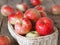 Agricultural apple background. Red early ripe apples on a wooden background