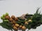 Agricultural background in green vegetables and fruits, which are laid out on a white natural background on brown paper. Cucumbers