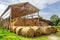 Agricultural barn canopy with round bales hay