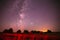 Agricultural Colorful Background Copy Space. Natural Real Night Sky Stars With Milky Way Over Field Meadow With Rolls Of