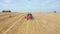 Agricultural Combine Harvester Collect Of Wheat Crops On Rural Field Aerial View