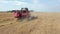 Agricultural Combine Machine Harvester Of Grain Crops On Rural Field Aerial View