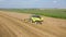 Agricultural Combine Machine Harvester Of Grain Crops On Rural Field Aerial View