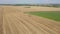 Agricultural Combine Machine Harvester Of Grain Crops On Wheat Field Aerial View