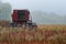 Agricultural Combine sits idle in a field